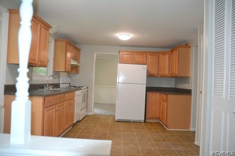 517 Wolfberry Road North Chesterfield, VA 23236 - Photo 5 of 15 a kitchen with refrigerator a stove a sink and a window