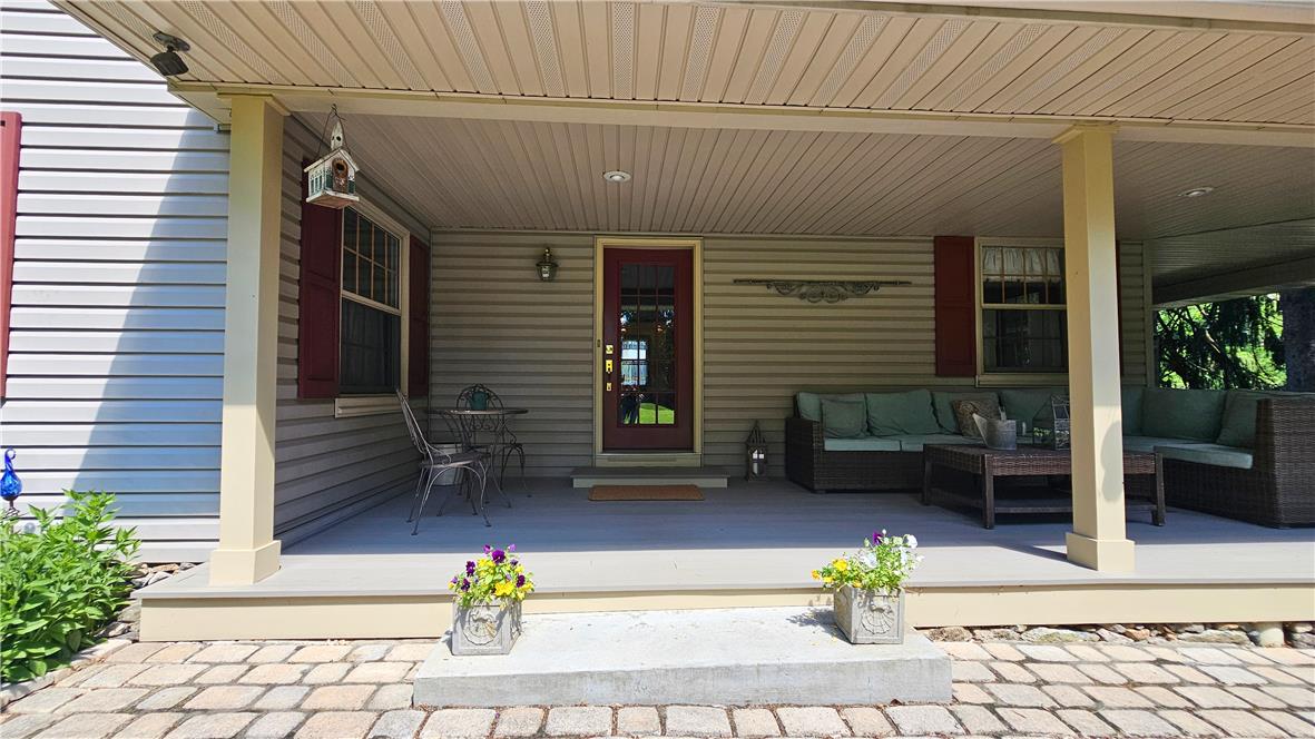585 Buttermilk Road Hellertown, PA 18055 - Photo 4 of 82 An inviting covered porch offers generous space for outdoor lounging and entertaining.
