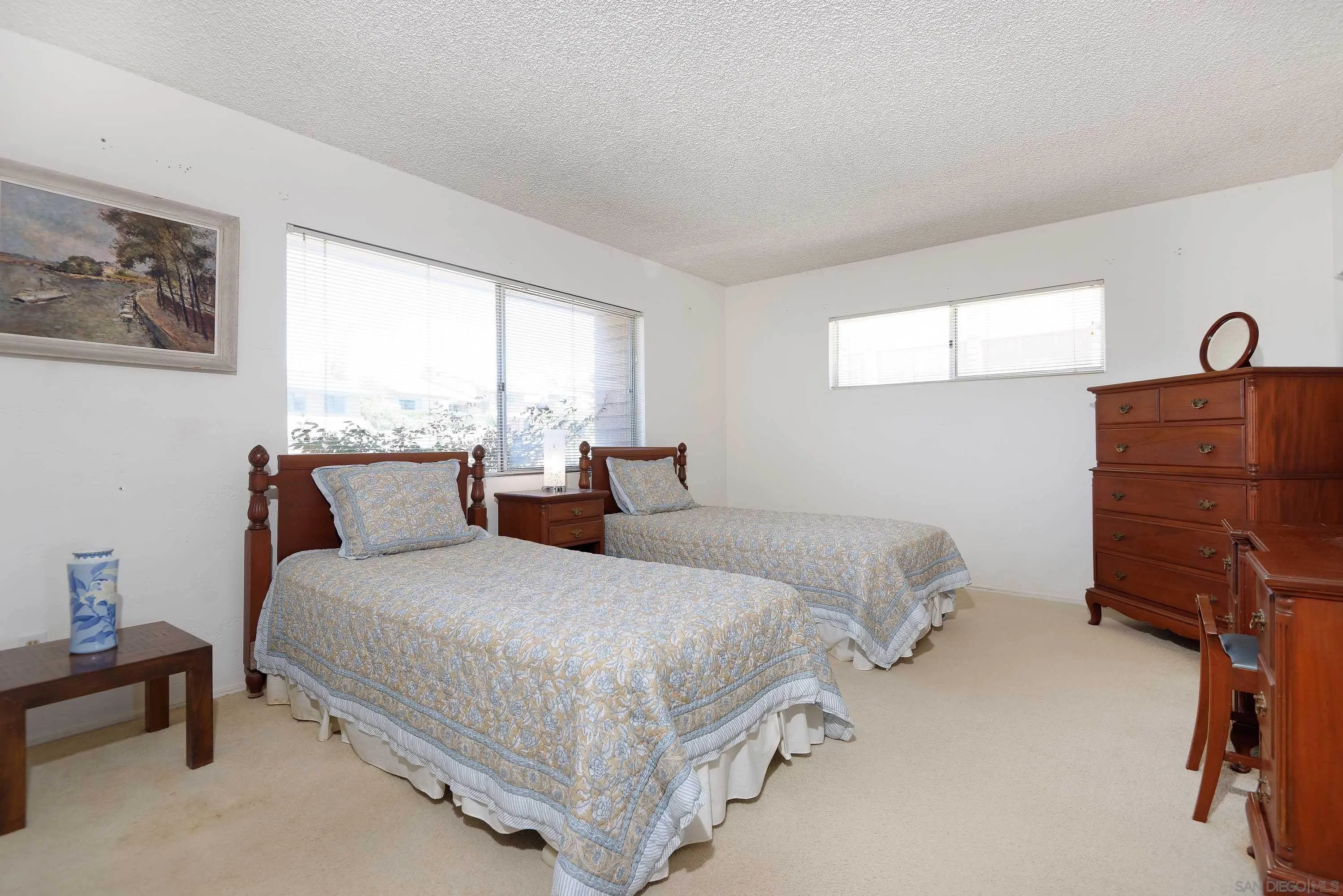 5571 Candlelight Drive La Jolla, CA 92037 - Photo 17 of 25 a bedroom with a bed and window