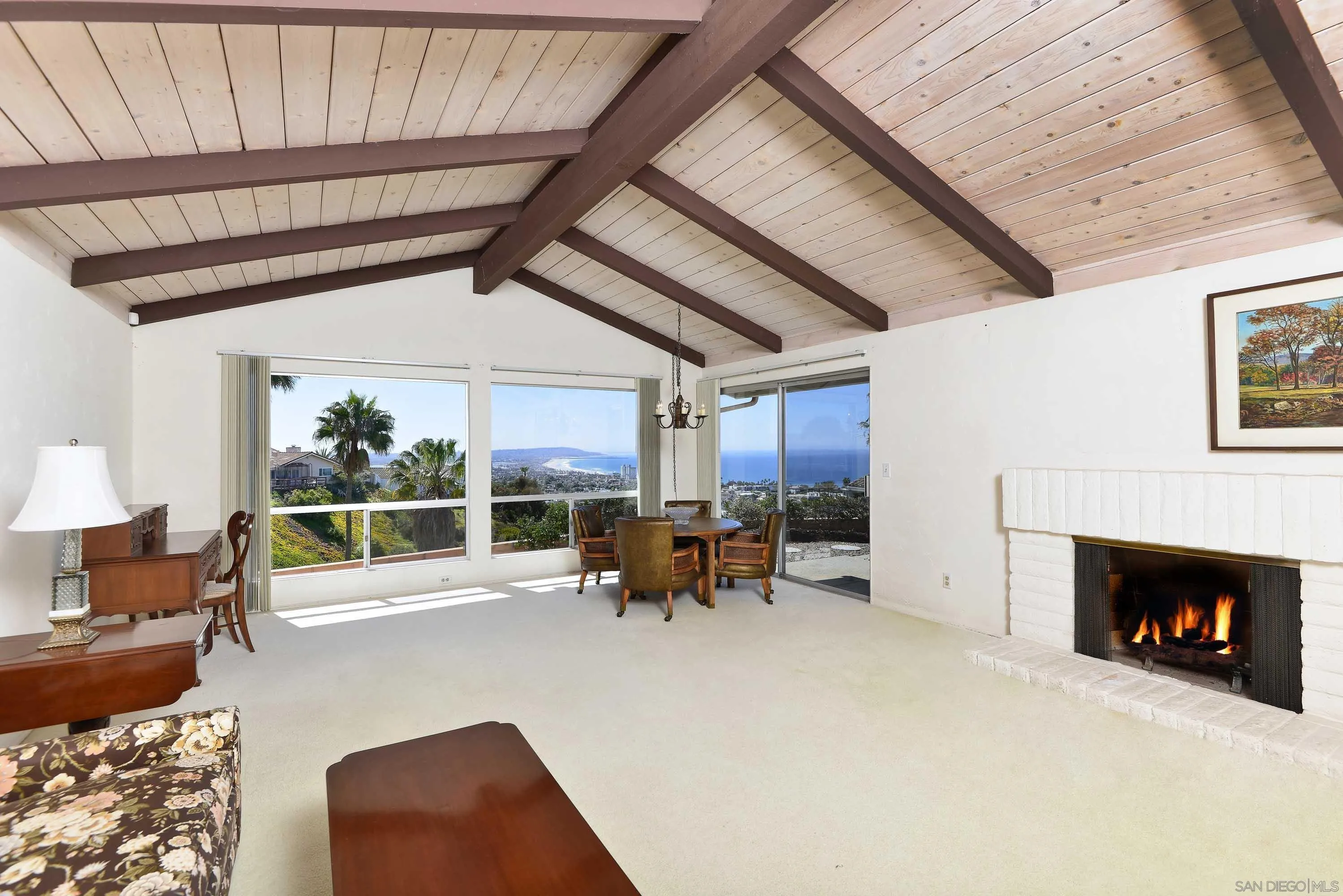 5571 Candlelight Drive La Jolla, CA 92037 - Photo 5 of 25 a living room with furniture and a fireplace