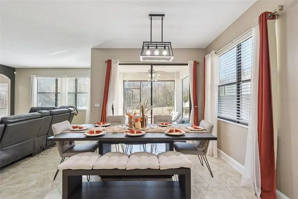 a kitchen with stainless steel appliances granite countertop a sink and a refrigerator