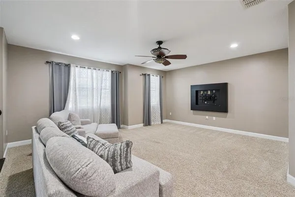 a spacious bedroom with a bed and window