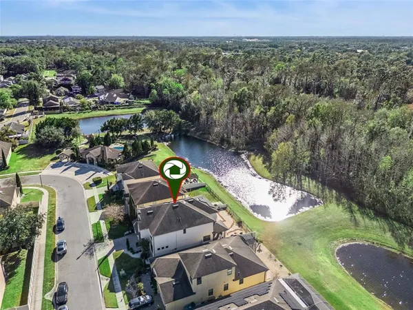 an aerial view of a house with swimming pool