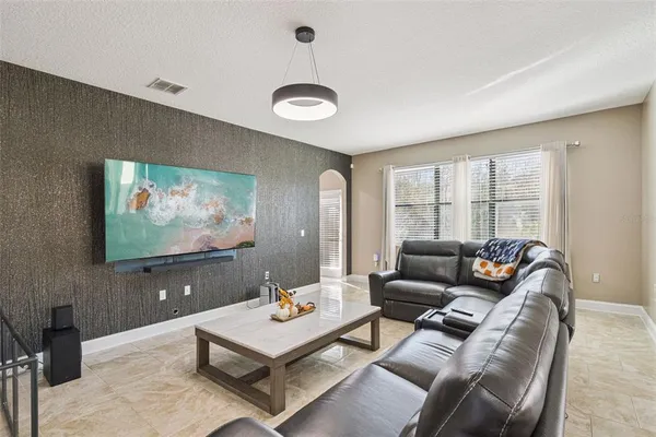 a kitchen with stainless steel appliances granite countertop a stove a sink dishwasher a refrigerator and cabinets with wooden floor