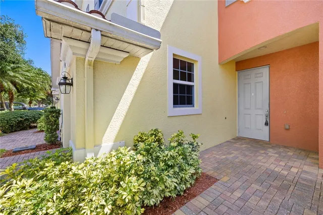 a view of a house with a flower garden