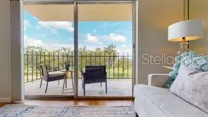a bath room with a table and a potted plant