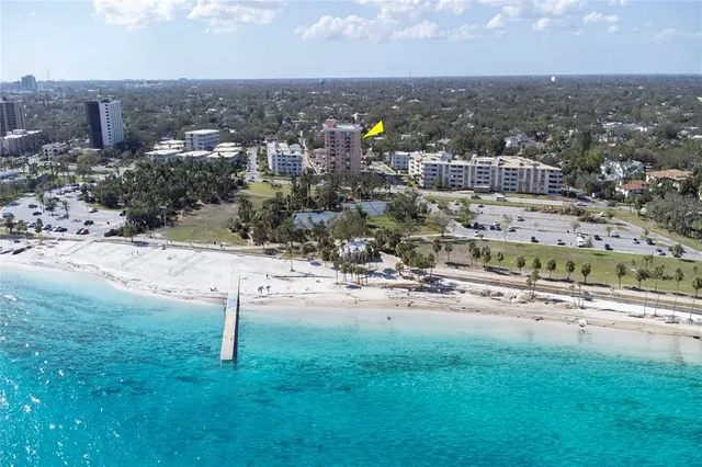 a lobby with furniture and potted plants