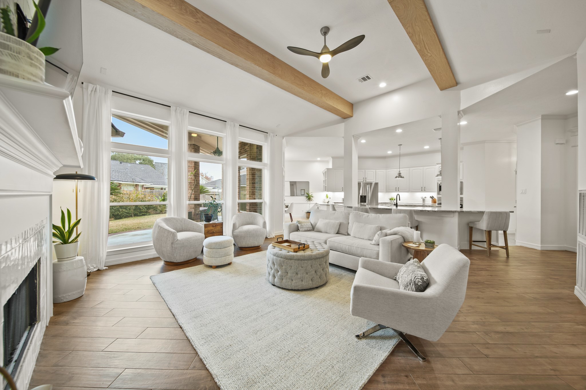 12210 Pebble Meadows Houston, TX 77041 - Photo 11 of 28 A striking view from the primary bedroom hallway opening into the expansive, light-filled main living area