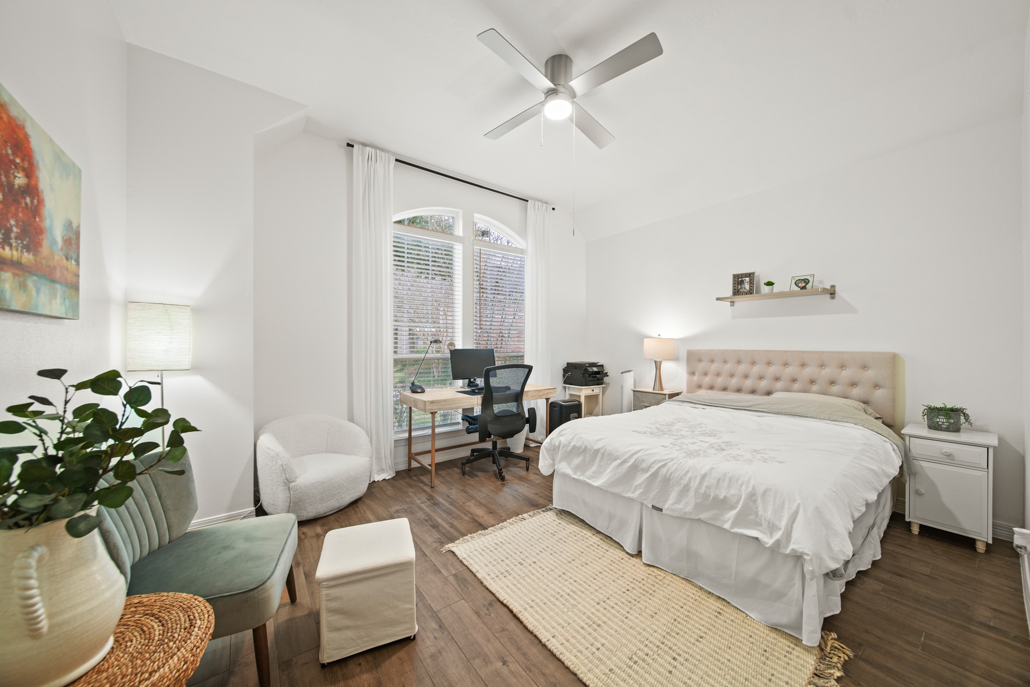 12210 Pebble Meadows Houston, TX 77041 - Photo 15 of 28 A bright, spacious secondary bedroom with 12-foot vaulted ceilings, an updated ceiling fan, and a walk-in closet with custom drawers and hanging systems