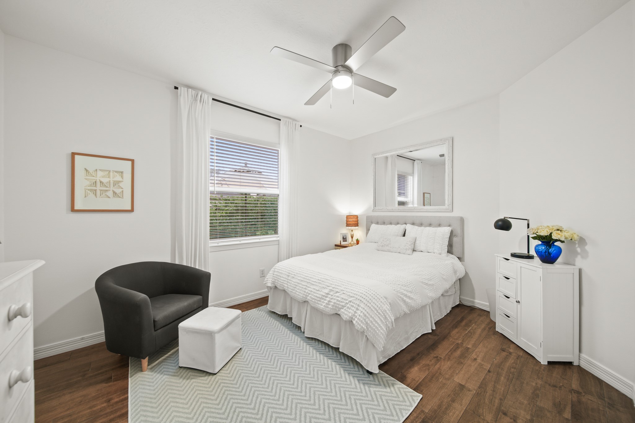 12210 Pebble Meadows Houston, TX 77041 - Photo 16 of 28 An airy secondary bedroom with soft natural light, modern finishes, and a walk-in closet with custom drawer and hanging system