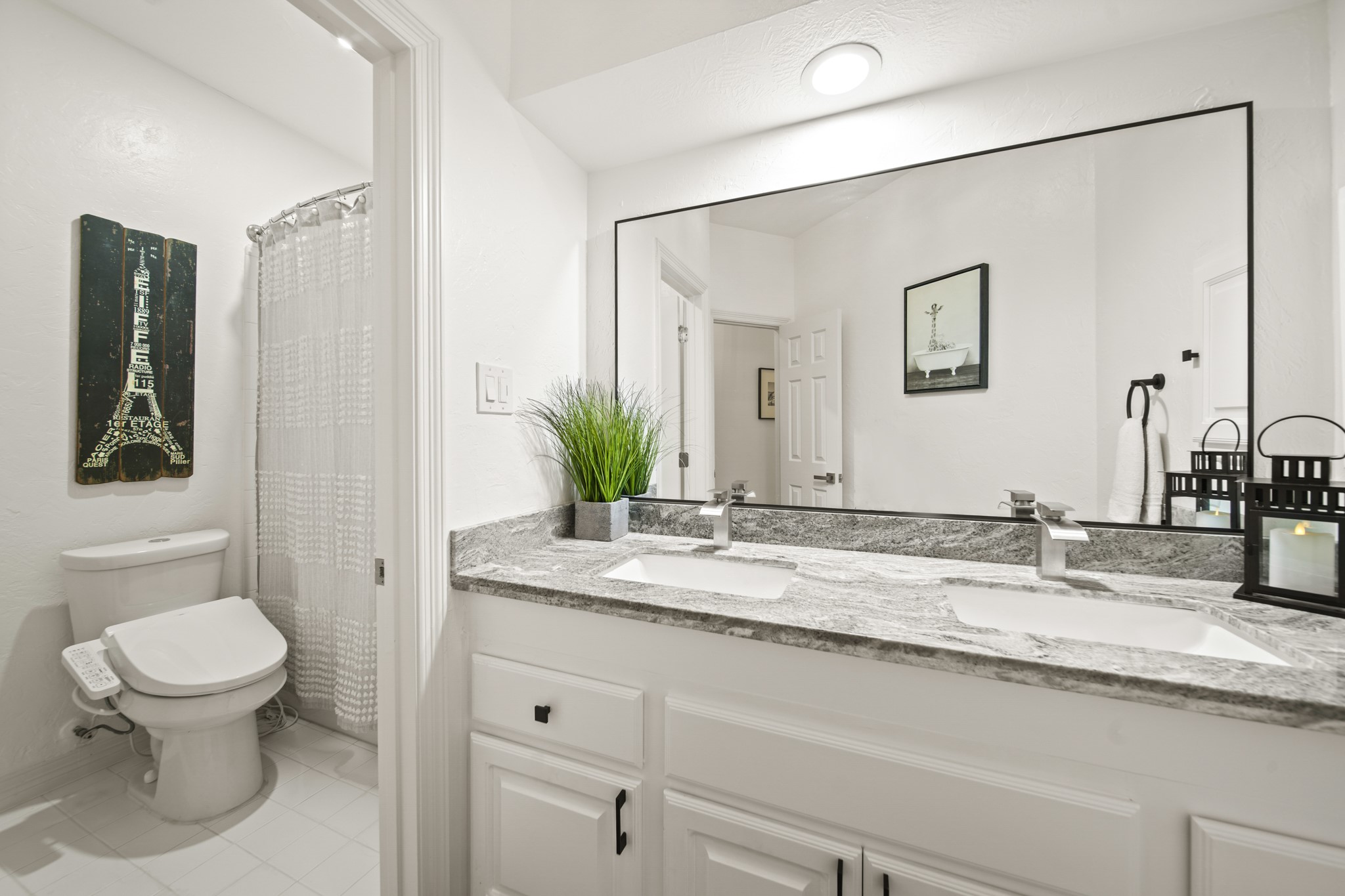 12210 Pebble Meadows Houston, TX 77041 - Photo 18 of 28 A newly updated secondary bathroom with dual sinks, granite countertops, white cabinetry, and a full tub-shower combination