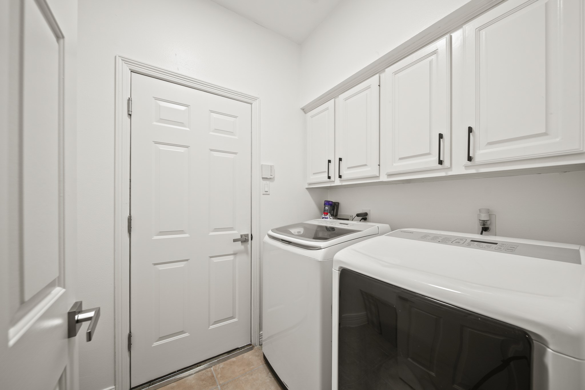12210 Pebble Meadows Houston, TX 77041 - Photo 19 of 28 Utility room with a closet connecting to the 3-car garage