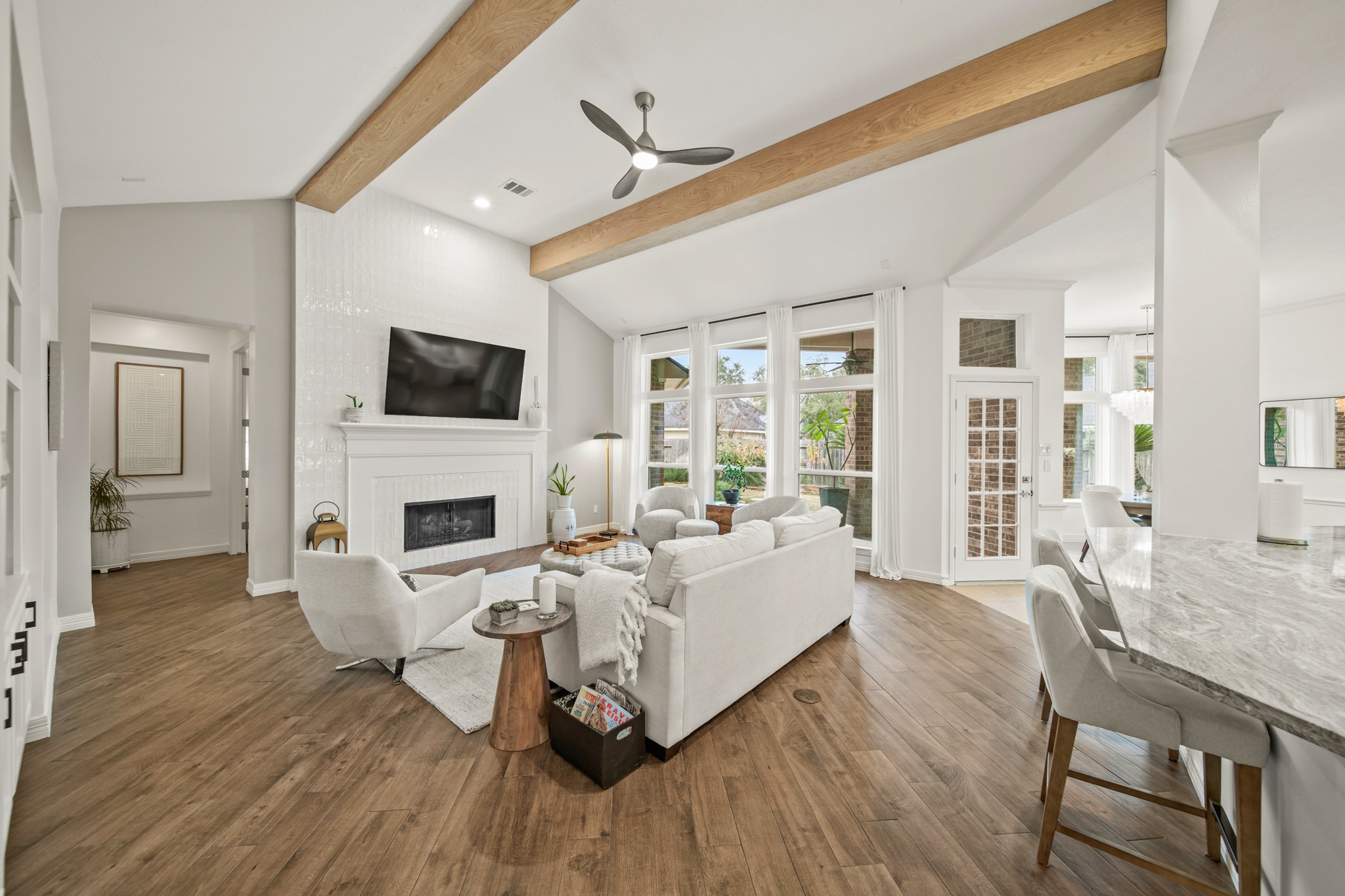 12210 Pebble Meadows Houston, TX 77041 - Photo 5 of 28 a living room with fireplace furniture and a flat screen tv