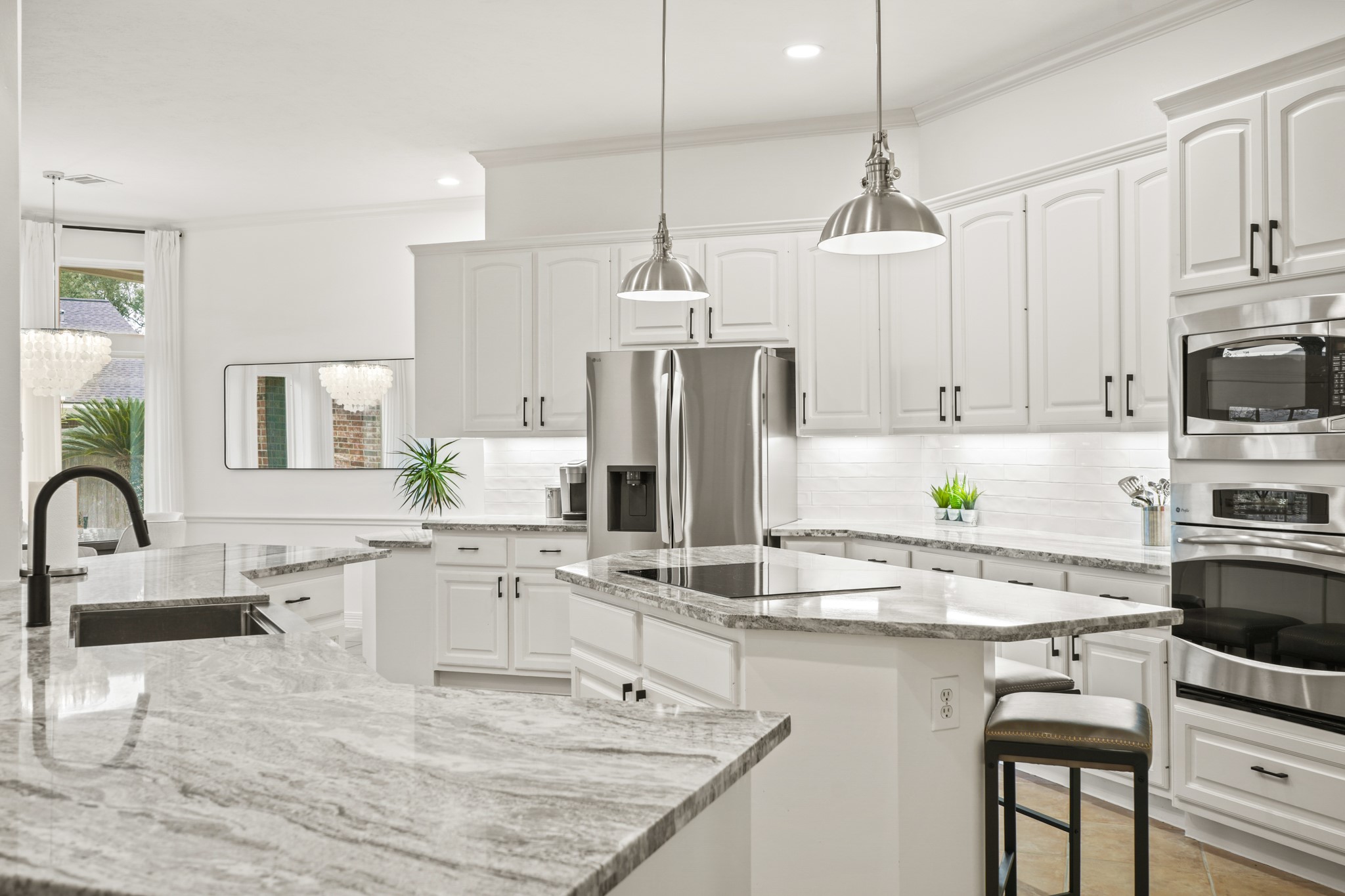12210 Pebble Meadows Houston, TX 77041 - Photo 6 of 28 a kitchen with stainless steel appliances granite countertop a sink stove and refrigerator