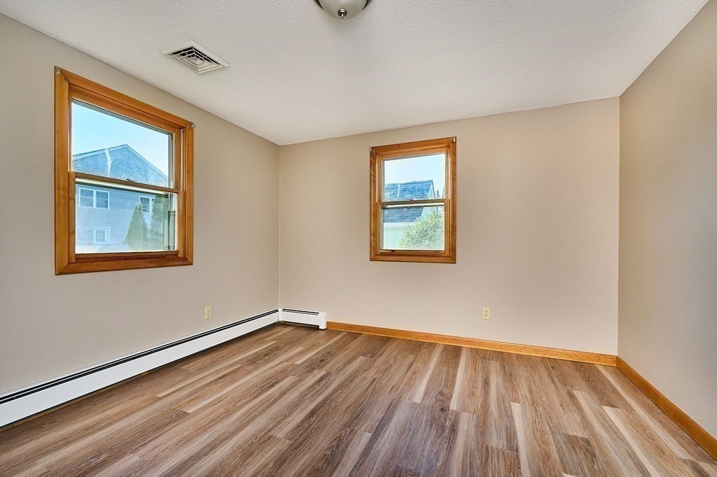 56 Thaddeus Street Chicopee, MA 01020 - Photo 12 of 24 a view of empty room with wooden floor and fan