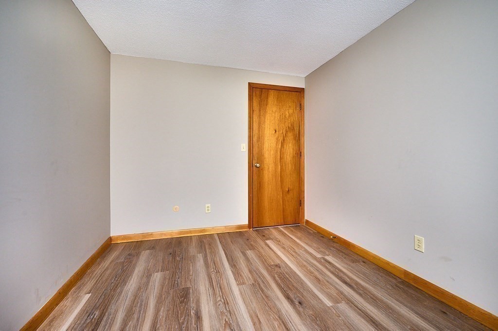 56 Thaddeus Street Chicopee, MA 01020 - Photo 13 of 24 a view of room with window and hardwood floor
