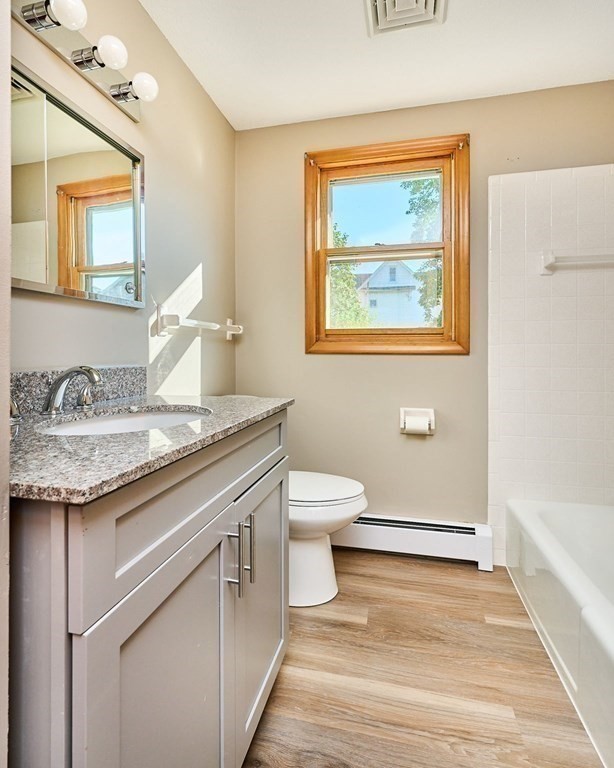 56 Thaddeus Street Chicopee, MA 01020 - Photo 15 of 24 a bathroom with a granite countertop sink and a mirror