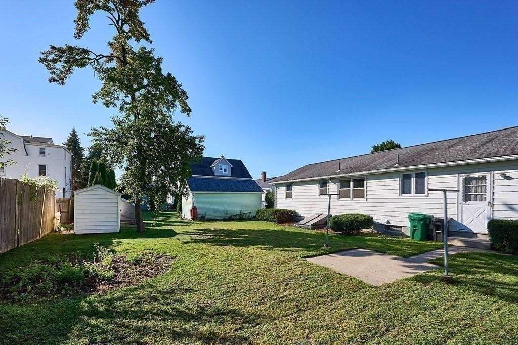 56 Thaddeus Street Chicopee, MA 01020 - Photo 21 of 24 a view of a house with a big yard and potted plants