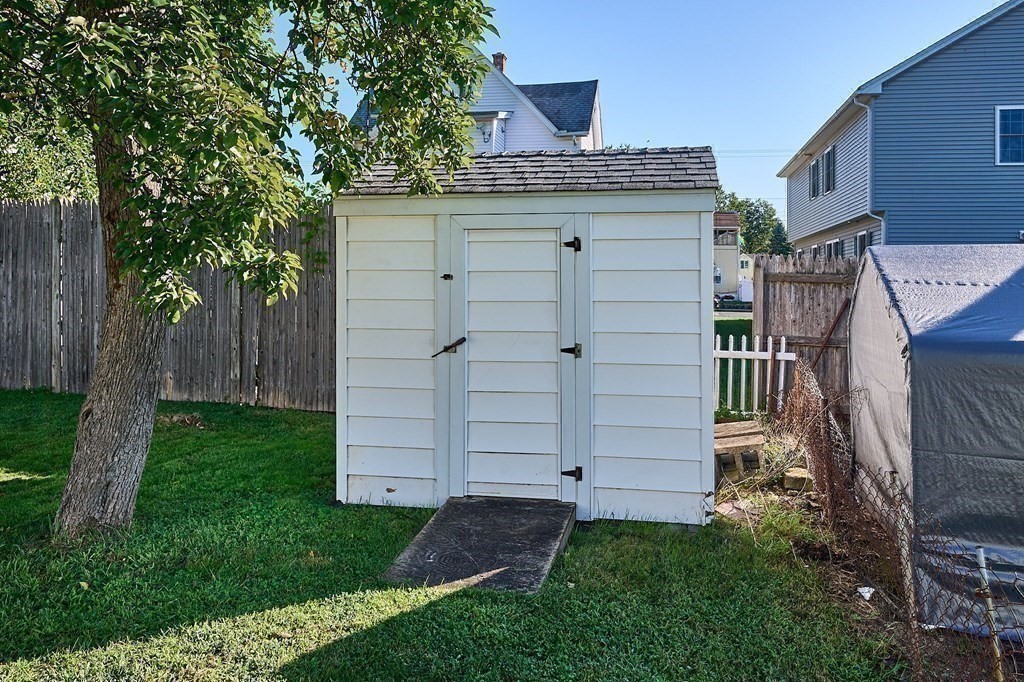 56 Thaddeus Street Chicopee, MA 01020 - Photo 22 of 24 a view of a house with a backyard