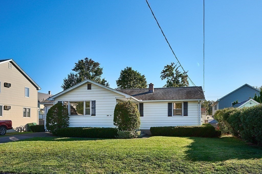 56 Thaddeus Street Chicopee, MA 01020 - Photo 23 of 24 a front view of a house with a garden