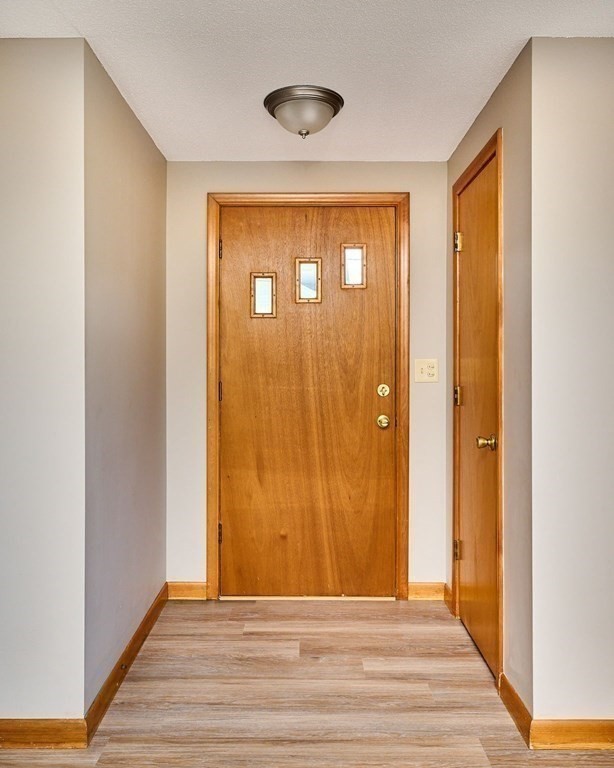 56 Thaddeus Street Chicopee, MA 01020 - Photo 8 of 24 a view of entryway with wooden floor
