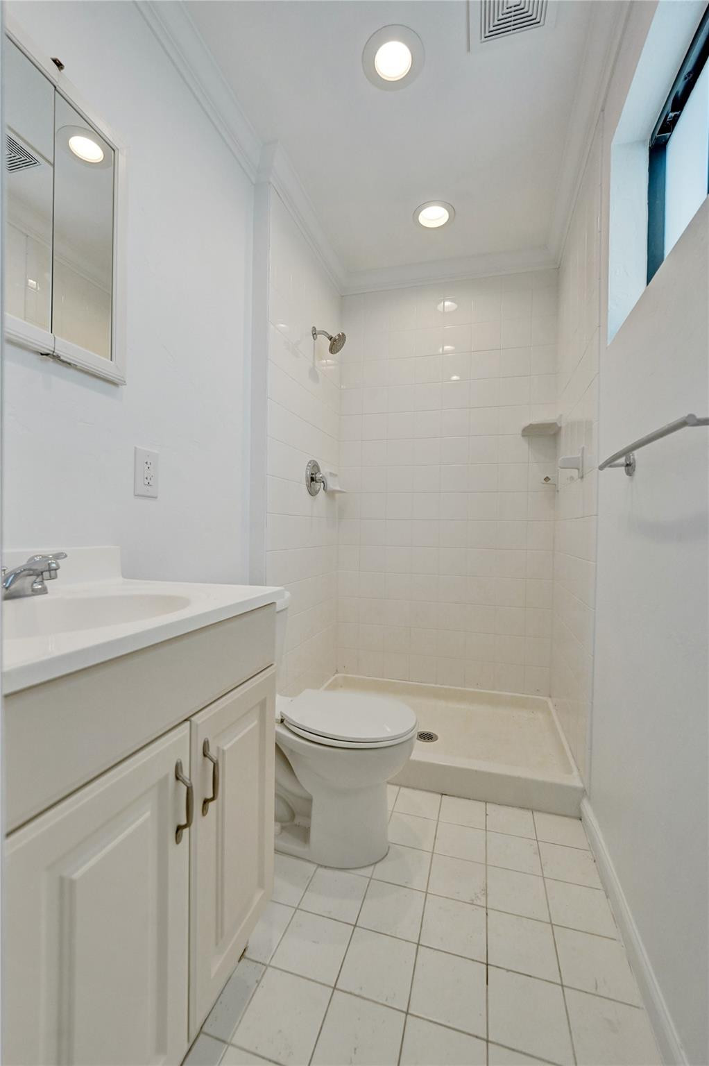 5001 Northeast 23rd Avenue Lighthouse Point, FL 33064 - Photo 22 of 34 a bathroom with a sink a toilet and shower