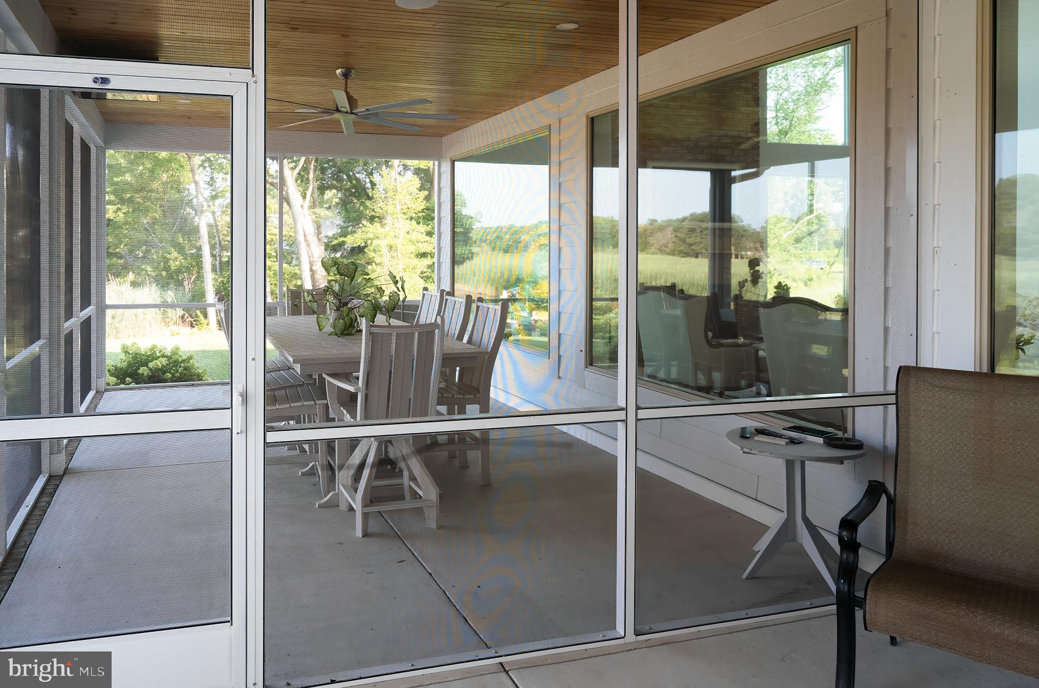 28135 Round Pole Bridge Road Milton, DE 19968 - Photo 74 of 82 outdoor dining space screened in
