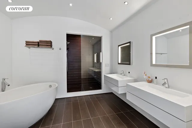 a living room with furniture and large windows