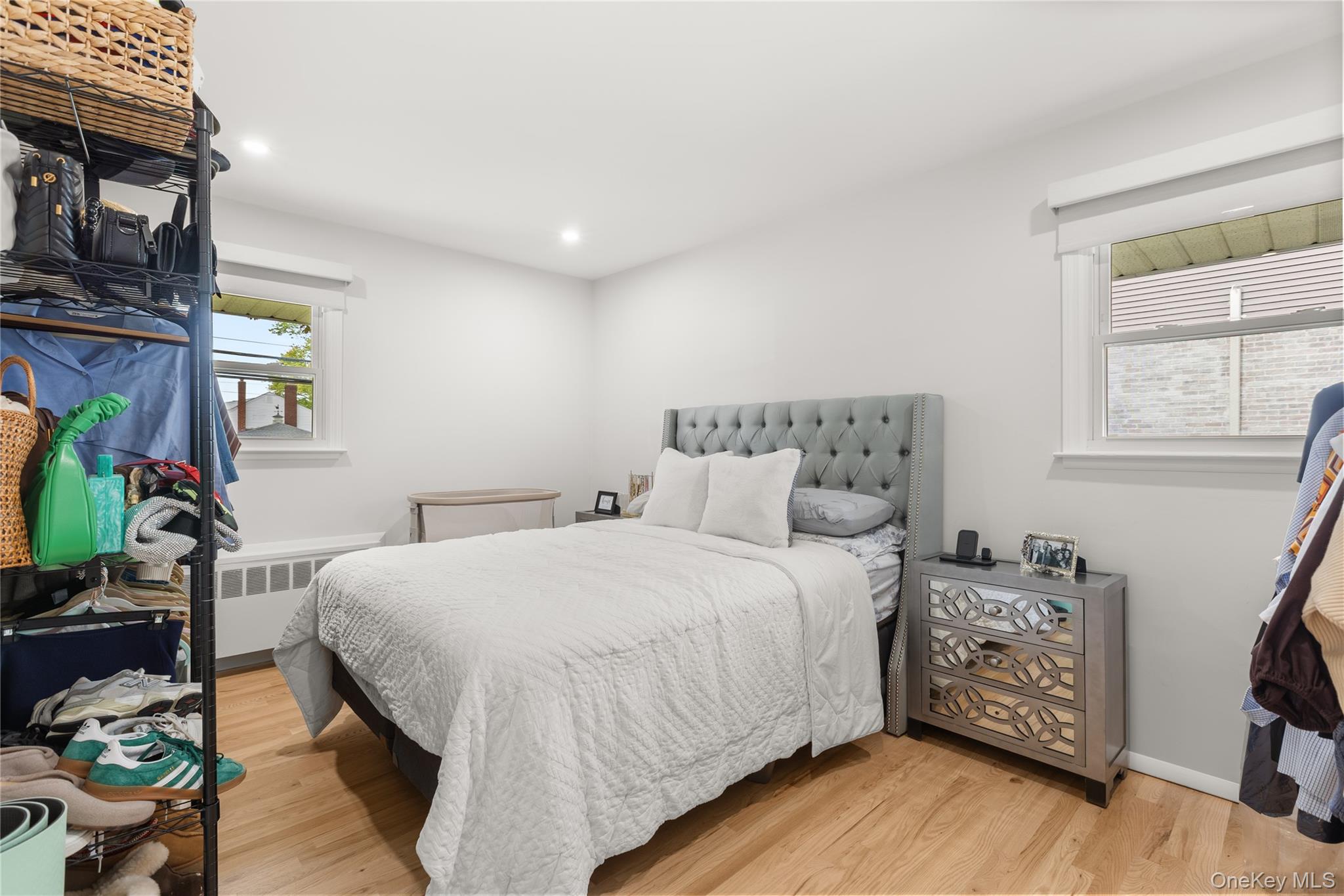 205 Timber Point Road East Islip, NY 11730 - Photo 9 of 16 Bedroom with light wood-type flooring, recessed lighting, and radiator