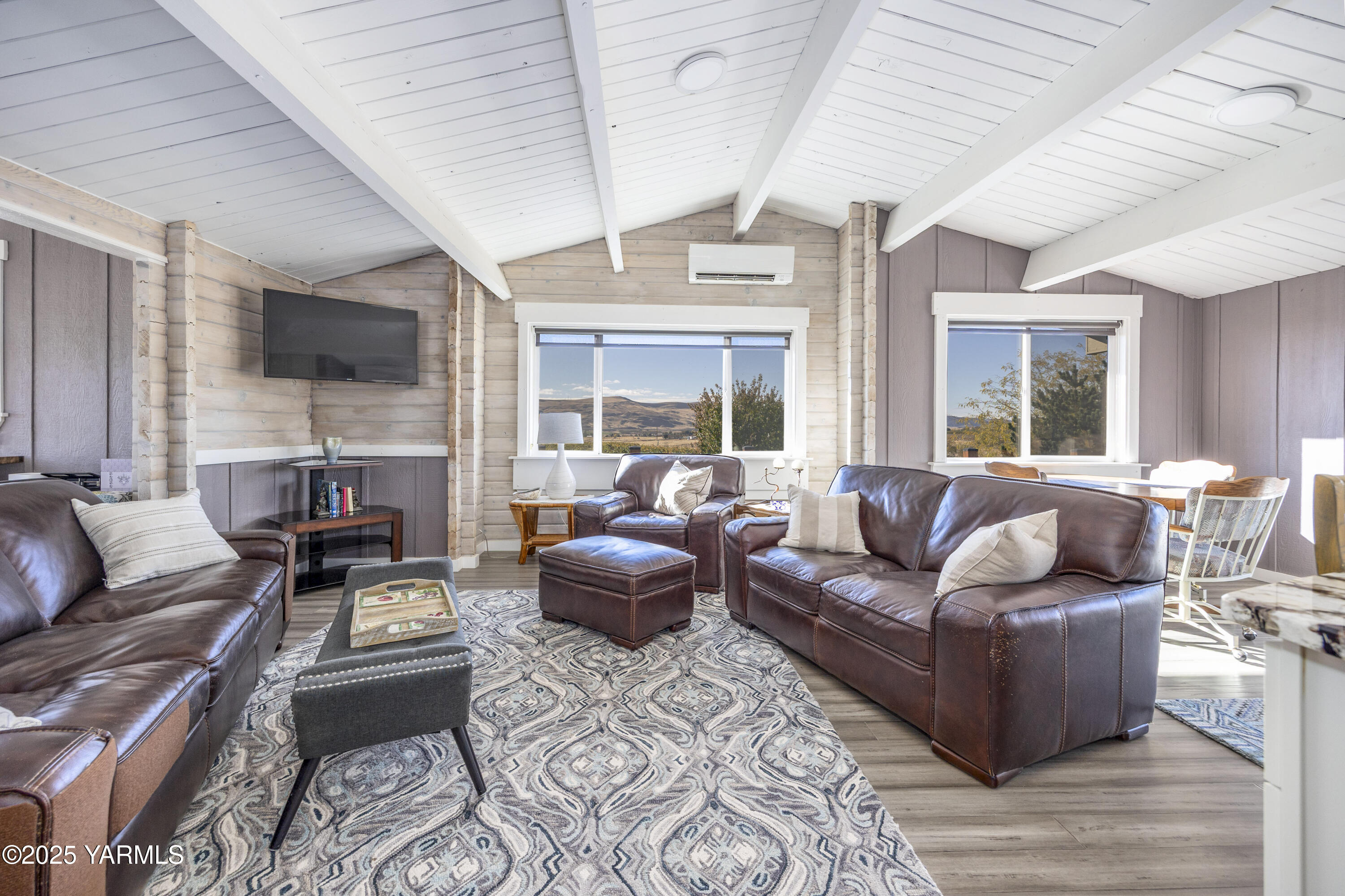 22207 West Gerrick Road Benton City, WA 99320 - Photo 22 of 60 a living room with furniture fireplace and a flat screen tv