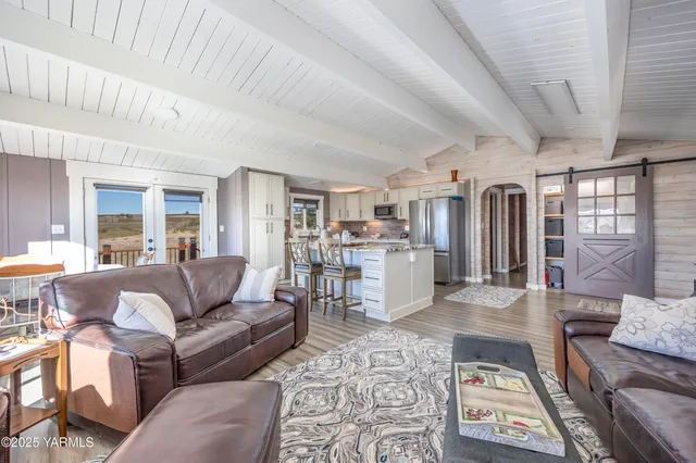a dining room with wooden floor and a table
