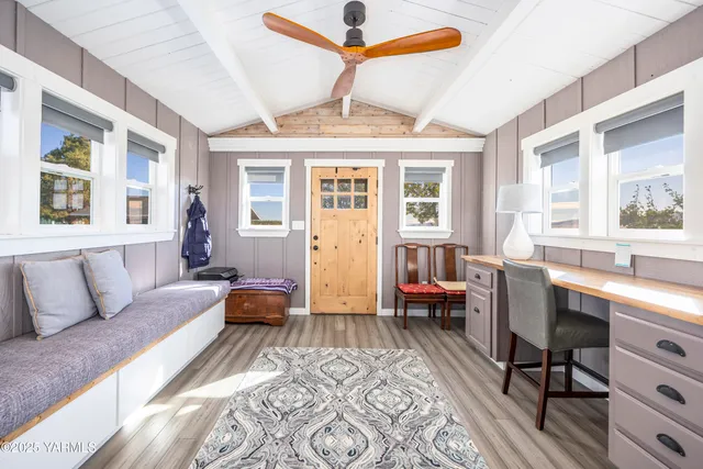 a bedroom with a bed dresser and a window