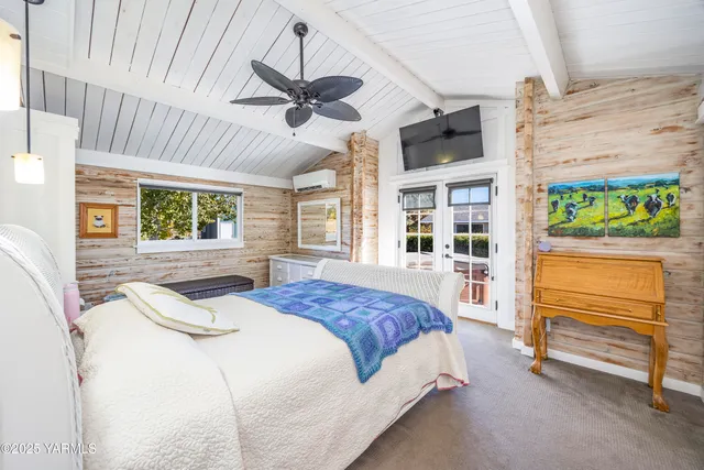 a spacious bathroom with a sink a shower and a mirror