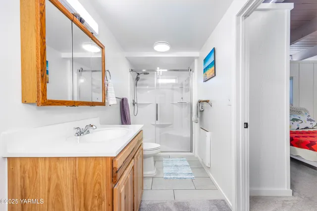 a bedroom with a bed and a couch