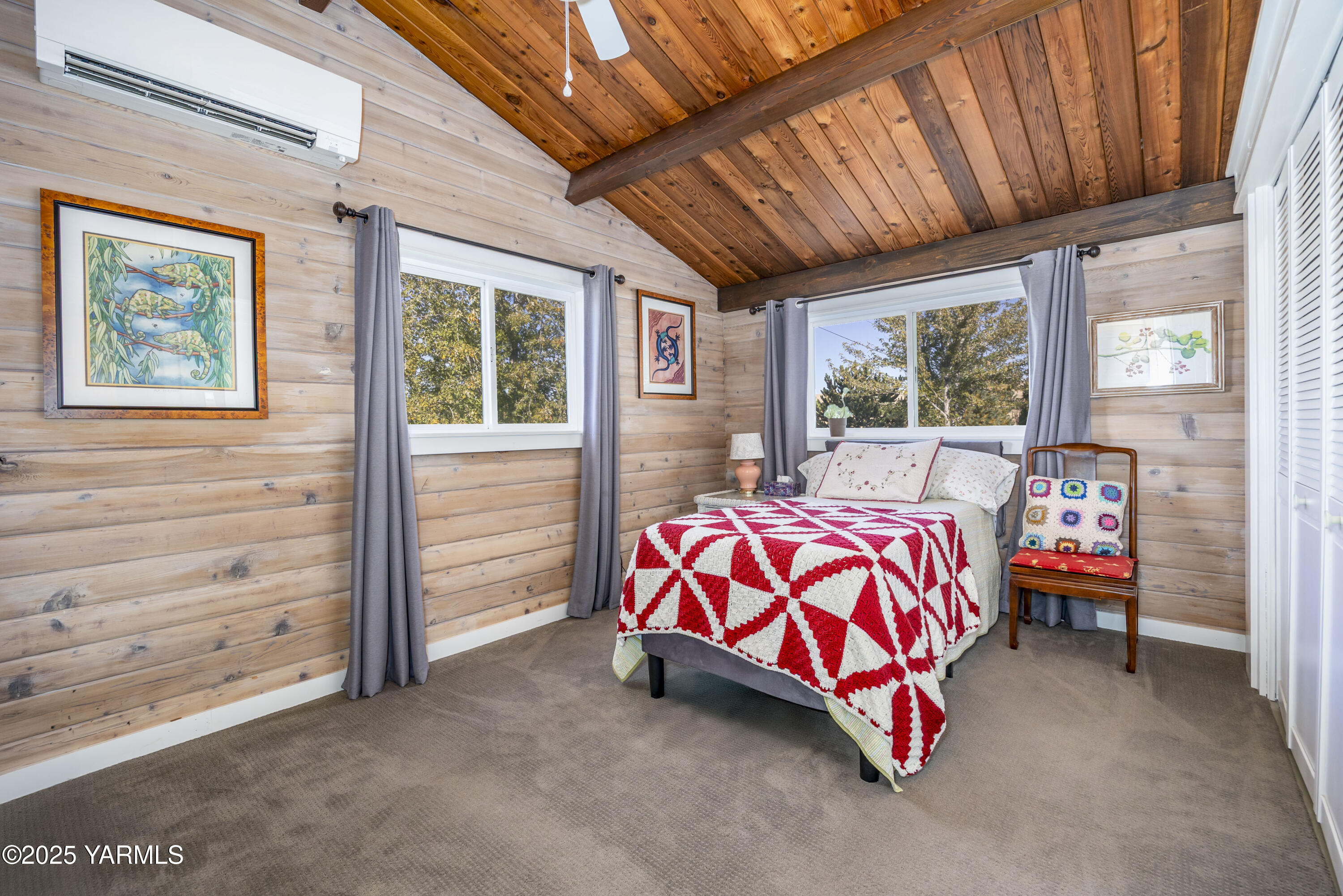 22207 West Gerrick Road Benton City, WA 99320 - Photo 35 of 60 a bedroom with a bed and a couch
