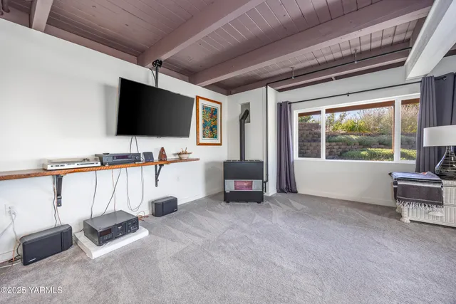 a bedroom with bed and wooden floor