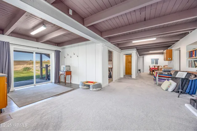 a view of a room with wooden walls