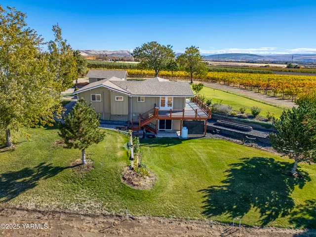 a view of a swimming pool with an outdoor seating and a yard