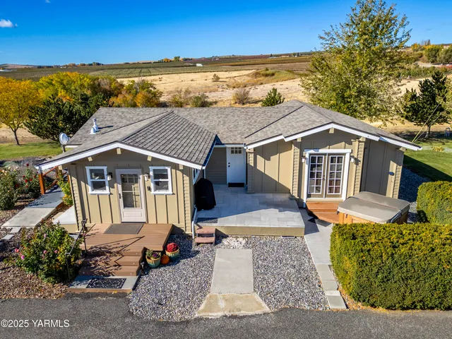 a aerial view of a house with a yard