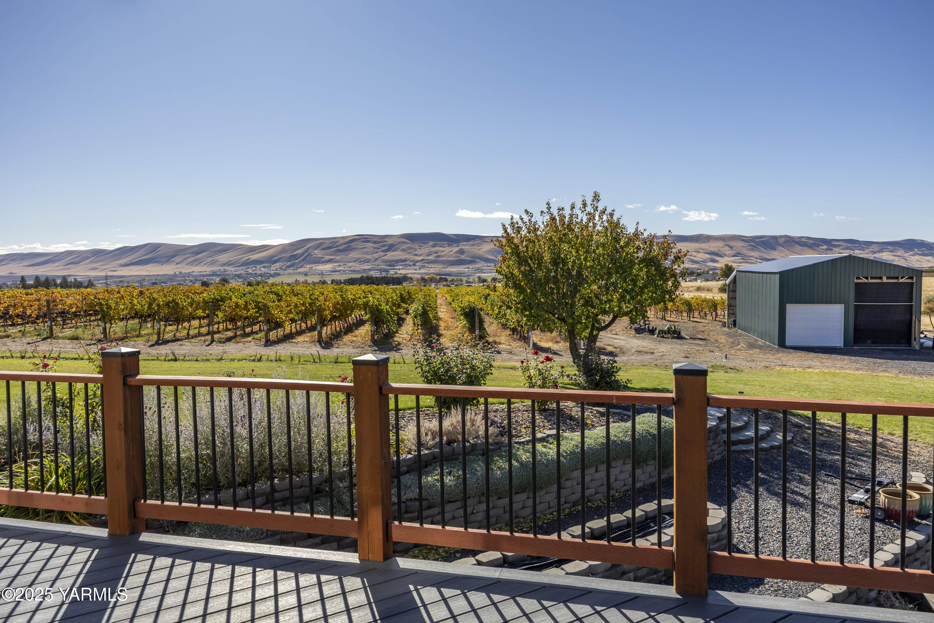 22207 West Gerrick Road Benton City, WA 99320 - Photo 55 of 60 a view of a balcony with wooden floor and fence