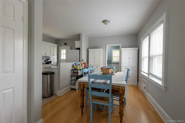 a view of a dining room with furniture and a window