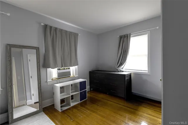 a view of room with window and furniture