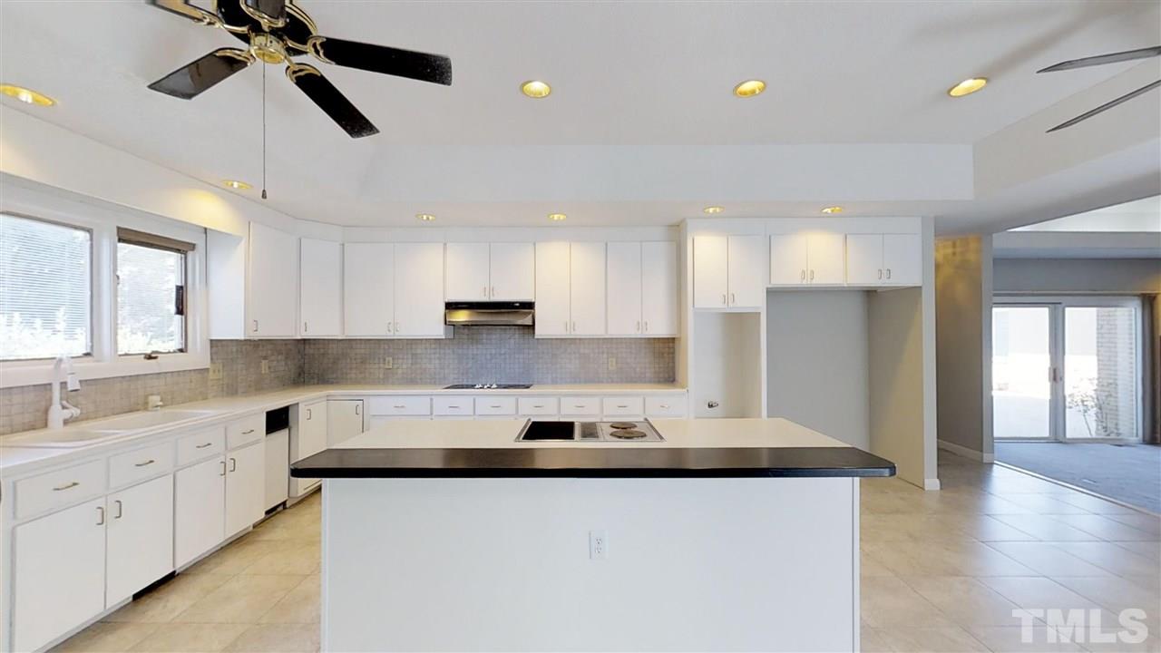 913 Windrow Lane Raleigh, NC 27603 - Photo 11 of 25 a kitchen with stainless steel appliances granite countertop a sink a stove and cabinets