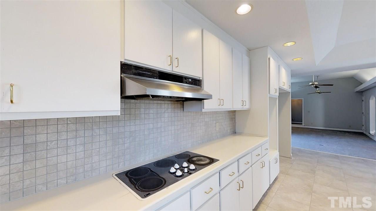 913 Windrow Lane Raleigh, NC 27603 - Photo 13 of 25 a kitchen with granite countertop cabinets and steel appliances
