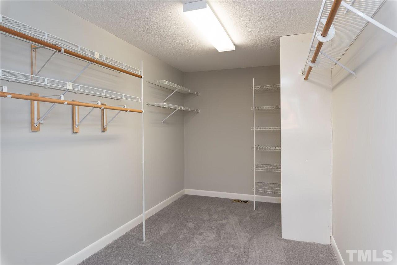 913 Windrow Lane Raleigh, NC 27603 - Photo 23 of 25 a view of walk in closet with empty racks