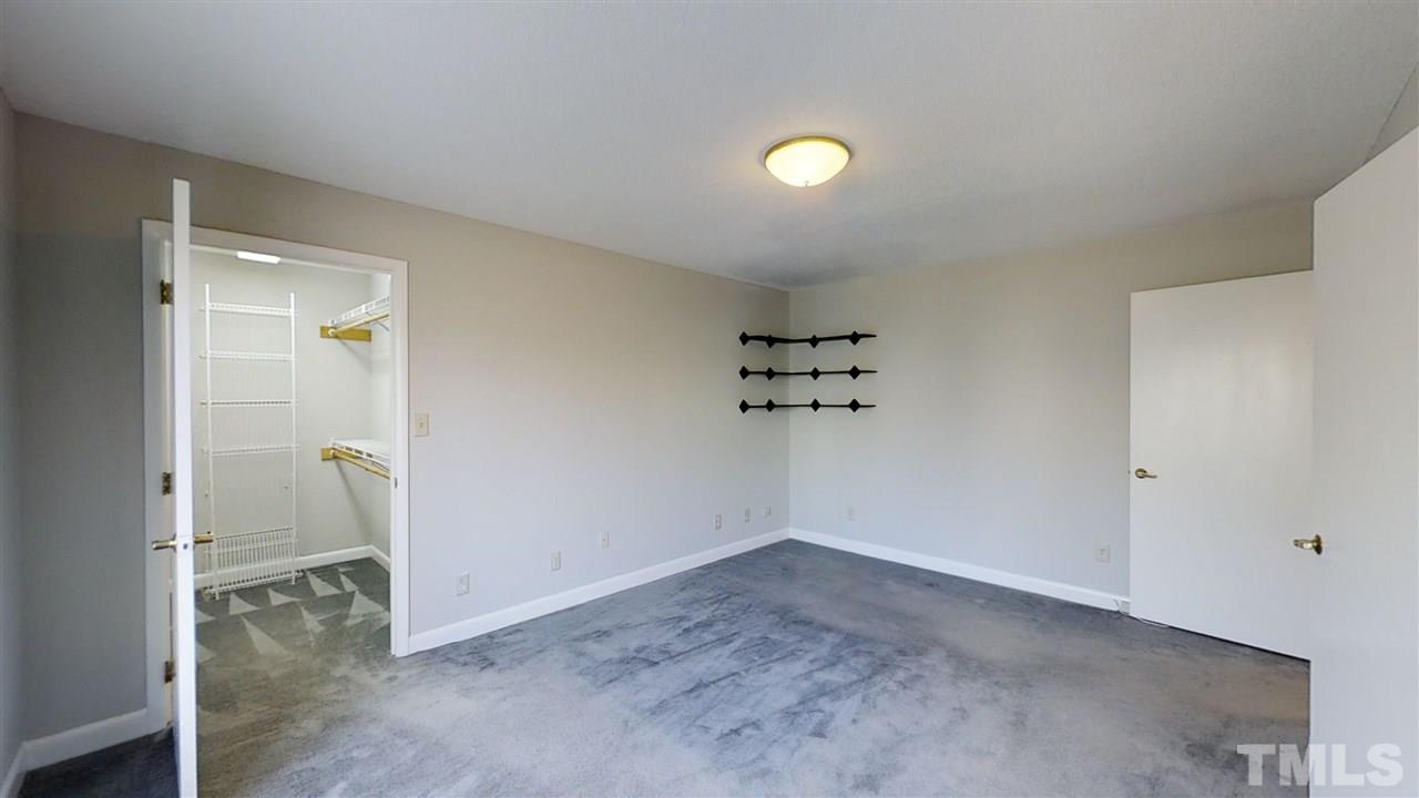913 Windrow Lane Raleigh, NC 27603 - Photo 25 of 25 an empty room and a bathroom with sink
