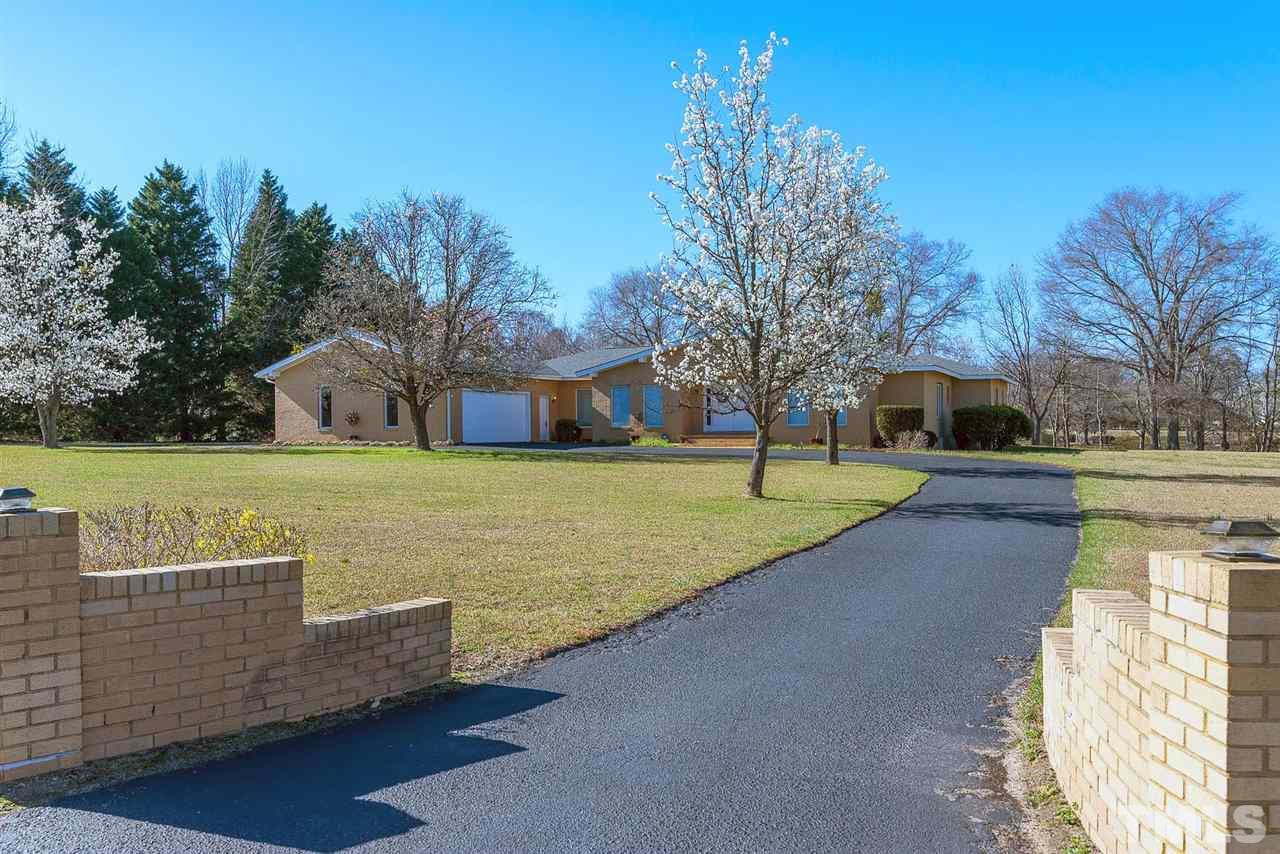913 Windrow Lane Raleigh, NC 27603 - Photo 4 of 25 a view of a house with yard and trees