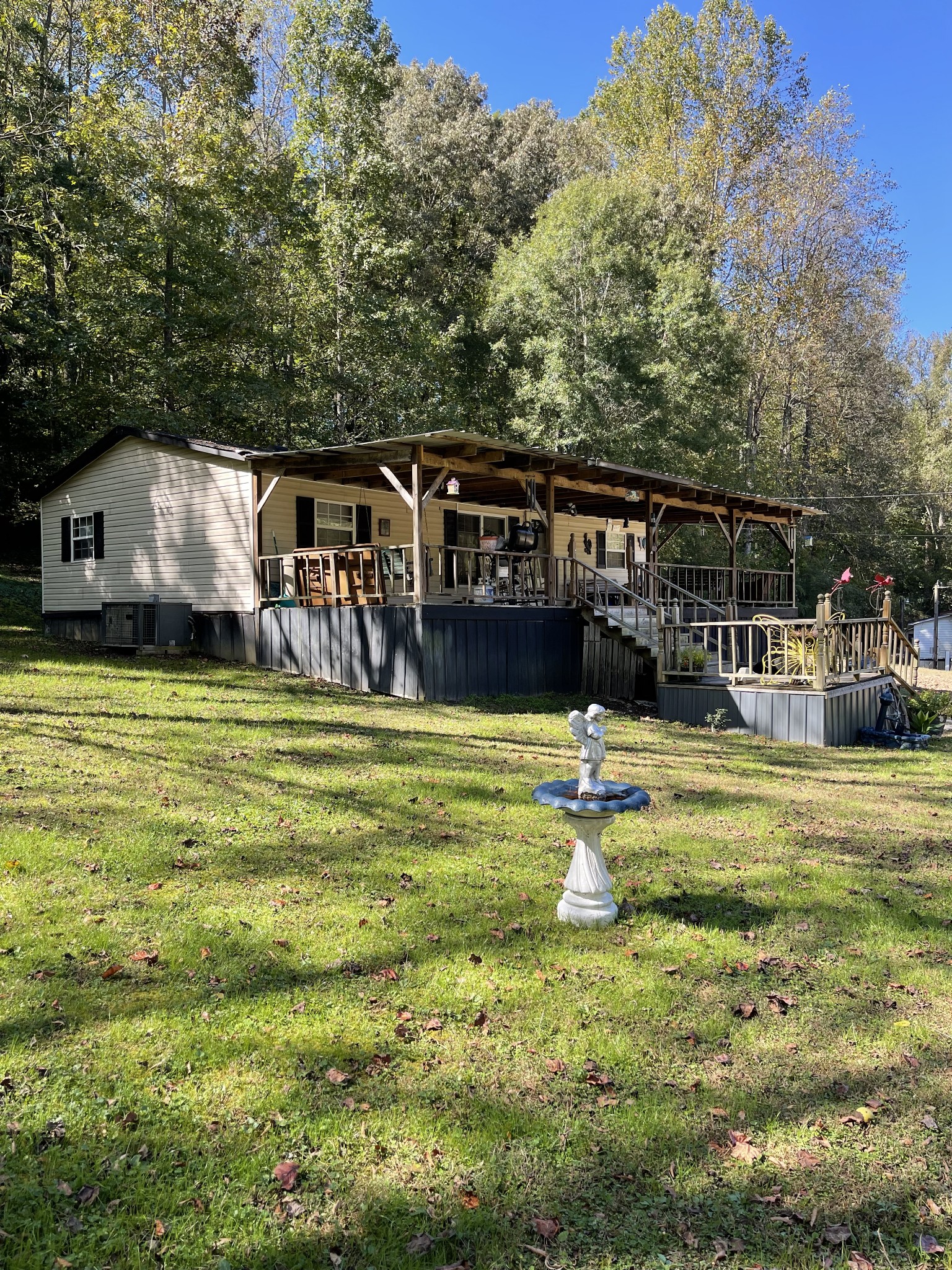 3221 Normandy Road Normandy, TN 37360 - Photo 2 of 36 a backyard of a house with yard and fountain