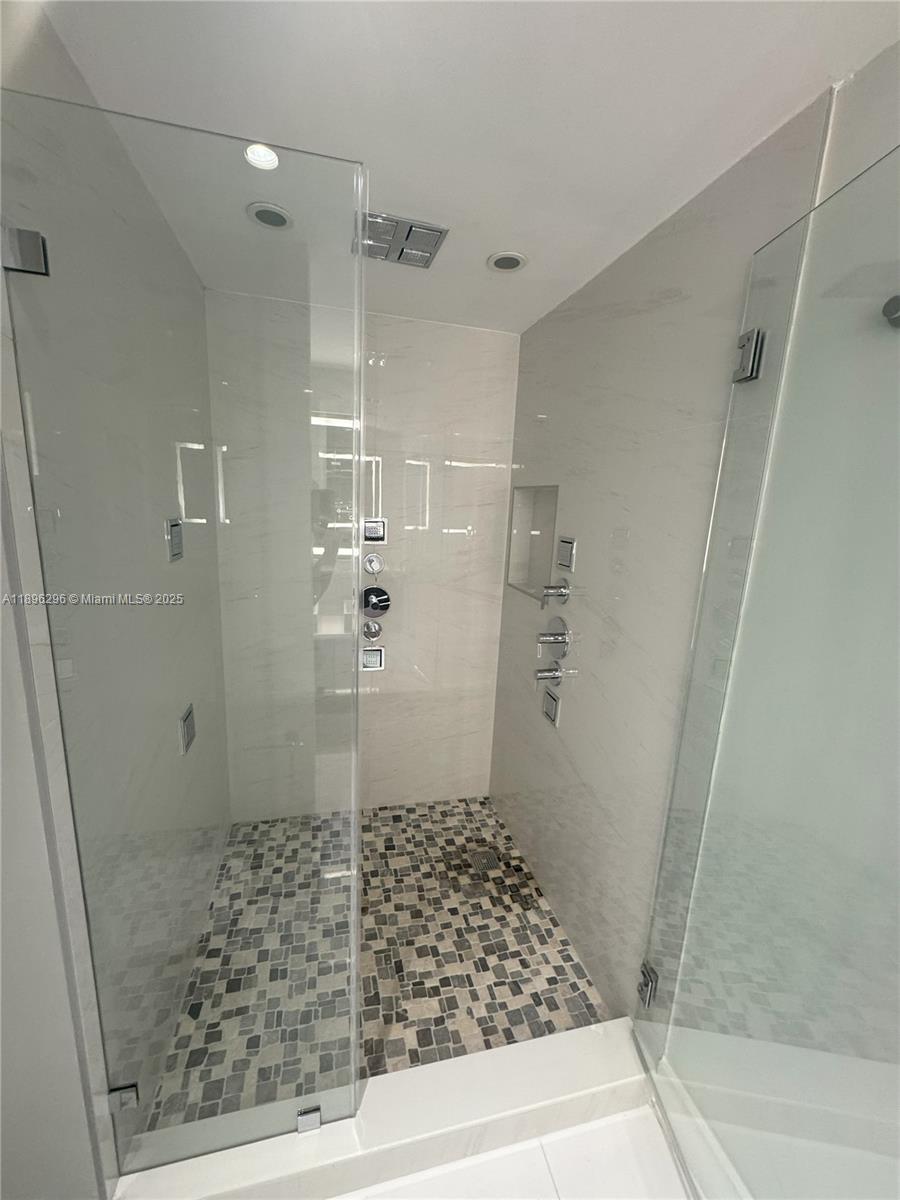 5970 Indian Creek Drive, Unit PH3 Miami Beach, FL 33140 - Photo 12 of 37 a bathroom with a shower