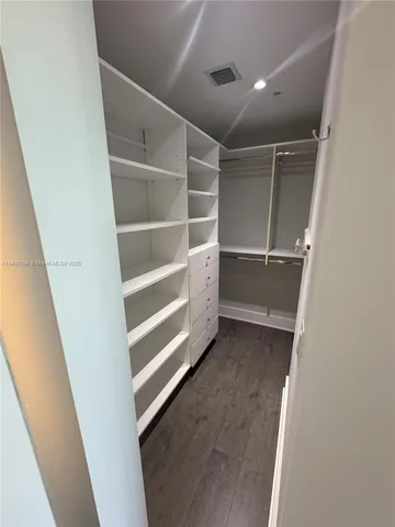 a view of an empty walk in closet
